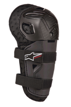 Alpinestars Bionic Action Kickstart Knee Guard, młodzieżowy ochraniacz kolan i goleni do motocrossu, czarny, z przegubową plastikową skorupą, podwójne zapięcie na elastyczne paski z białym logo i czerwonym napisem Kickstart, wyściełany spód z siateczki