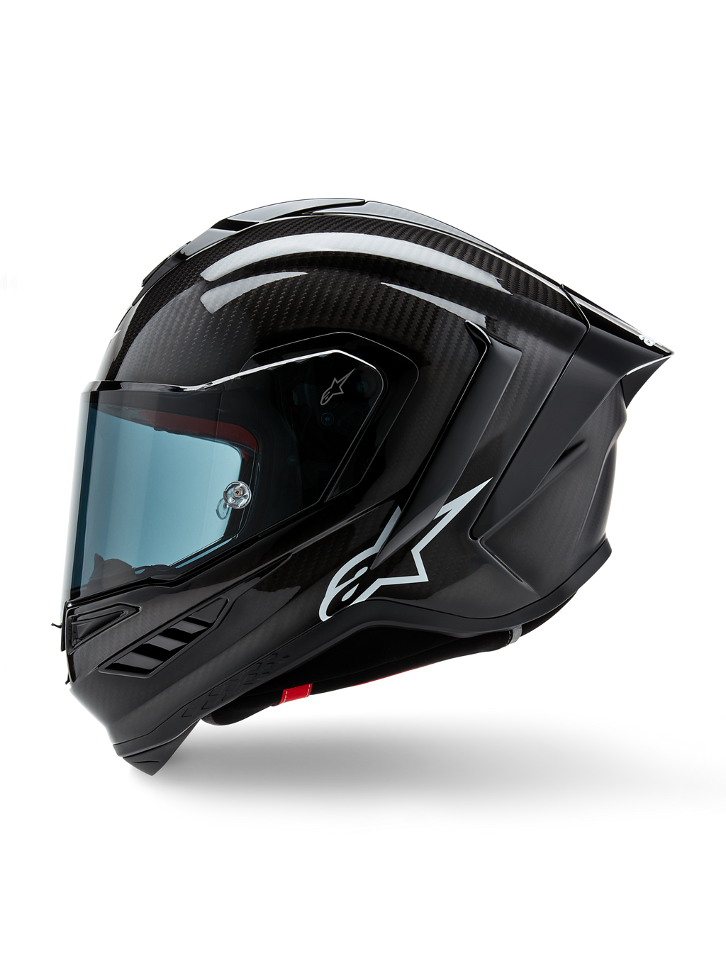 Alpinestars Supertech R10 Solid Helmet, motocyklowy kask wyścigowy, czarny karbon matowy i błyszczący, widoczny splot włókna węglowego, białe logo Alpinestars z boku, aerodynamiczna konstrukcja ze zintegrowanym tylnym spojlerem i otworami wentylacyjnymi, widok z profilu bocznego