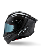 Alpinestars Supertech R10 Solid Helmet, motocyklowy kask wyścigowy, czarny karbon matowy i błyszczący, widoczny splot włókna węglowego, białe logo Alpinestars z boku, aerodynamiczna konstrukcja ze zintegrowanym tylnym spojlerem i otworami wentylacyjnymi, widok z profilu bocznego