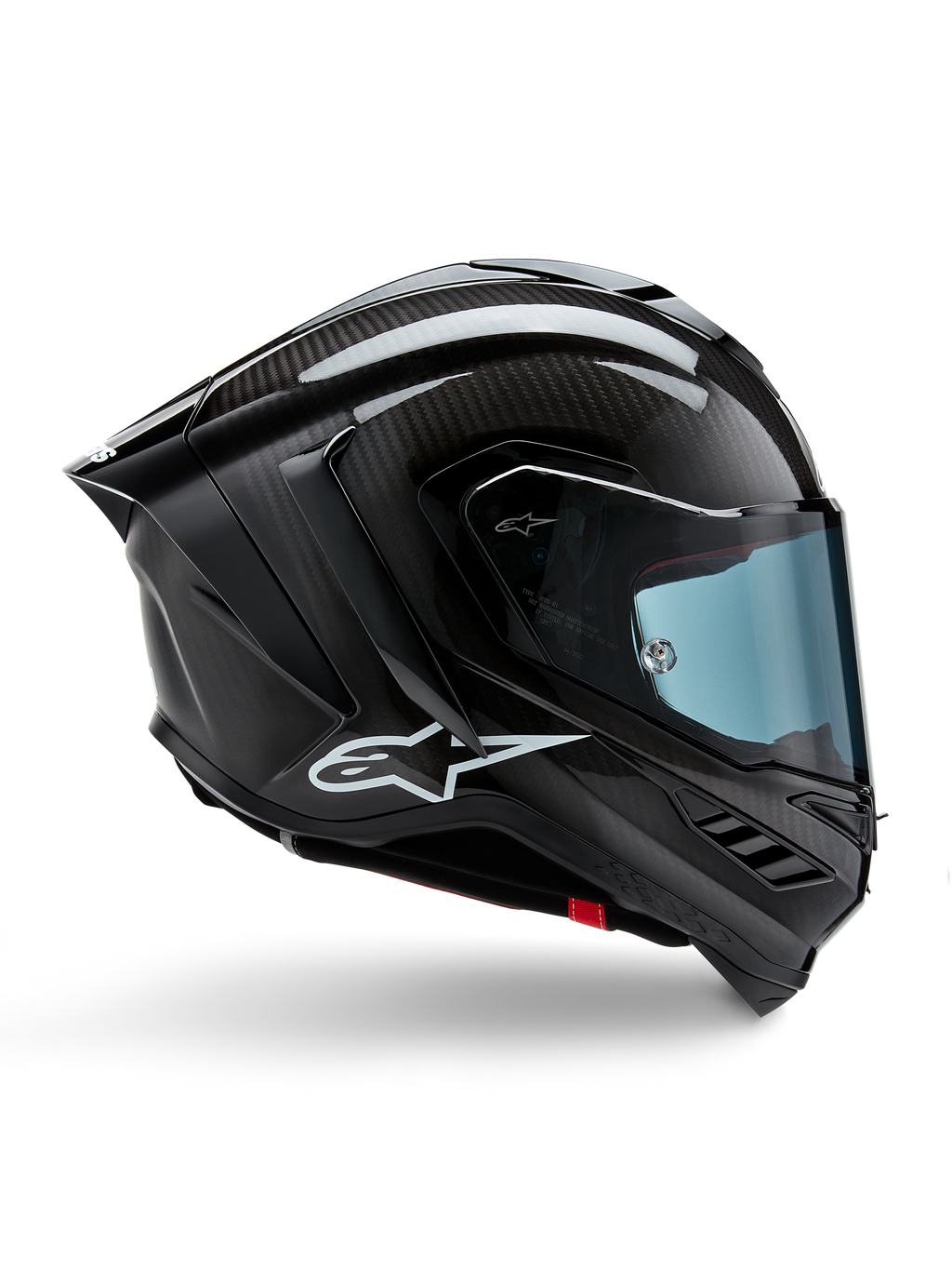 Kask Alpinestars Supertech R10 Solid, czarny karbon matowy i błyszczący, motocyklowy kask wyścigowy, konstrukcja z włókna węglowego, profil boczny, błękitna przyciemniana szyba, aerodynamiczny design ze skrzydełkami, białe logo, wysokowydajna ochrona na poziomie MotoGP