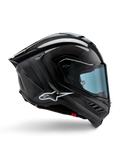 Kask Alpinestars Supertech R10 Solid, czarny karbon matowy i błyszczący, motocyklowy kask wyścigowy, konstrukcja z włókna węglowego, profil boczny, błękitna przyciemniana szyba, aerodynamiczny design ze skrzydełkami, białe logo, wysokowydajna ochrona na poziomie MotoGP