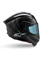 Kask Alpinestars Supertech R10 Solid, czarny karbon matowy i błyszczący, motocyklowy kask wyścigowy, konstrukcja z włókna węglowego, profil boczny, błękitna przyciemniana szyba, aerodynamiczny design ze skrzydełkami, białe logo, wysokowydajna ochrona na poziomie MotoGP