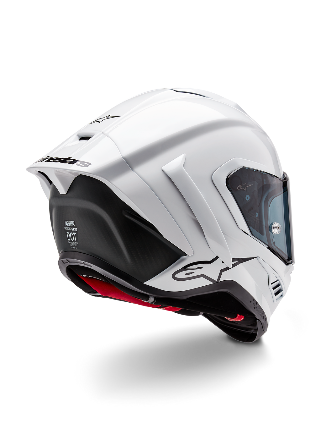 Kask Alpinestars Supertech R10 Solid, pełny kask motocyklowy wyścigowy, biały połysk i czarny mat, widok z tyłu pod kątem trzech czwartych z aerodynamicznym spojlerem, bocznymi skrzydełkami i czarnym logo marki