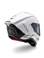 Kask Alpinestars Supertech R10 Solid, pełny kask motocyklowy wyścigowy, biały połysk i czarny mat, widok z tyłu pod kątem trzech czwartych z aerodynamicznym spojlerem, bocznymi skrzydełkami i czarnym logo marki