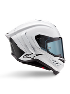 Alpinestars Supertech R10 Solid Helmet, wyścigowy kask motocyklowy, biały połysk i czarny mat, profil boczny, aerodynamiczny design z tylnymi skrzydełkami i bocznymi wlotami powietrza, niebieski przyciemniany wizjer, czarne logo gwiazdy Alpinestars na boku