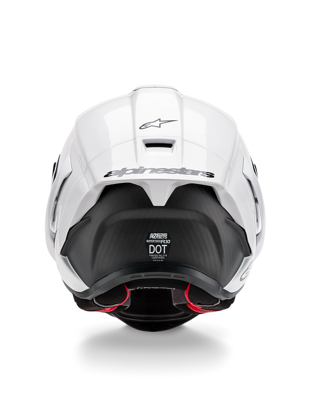 Alpinestars Supertech R10 Solid Helmet, widok z tyłu, biała błyszcząca góra z czarną matową dolną częścią, aerodynamiczny spojler z czarnym logo Alpinestars, widoczna tekstura włókna węglowego i naklejki z certyfikatami bezpieczeństwa