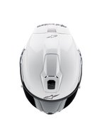 Kask Alpinestars Supertech R10 Solid, motocyklowy kask integralny, biały połysk, widok z góry podkreślający otwory wentylacyjne i czarne logo Alpinestars, smukły profil inspirowany wyścigami