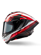Kask Alpinestars Supertech R10 Team, pełny kask motocyklowy wyścigowy, błyszczące wykończenie w kolorach czarnego karbonu, czerwieni i bieli, profil boczny ukazujący aerodynamiczny design, wyraziste czerwone napisy „One Vision” i „Racing Ahead”, konstrukcja z włókna węglowego
