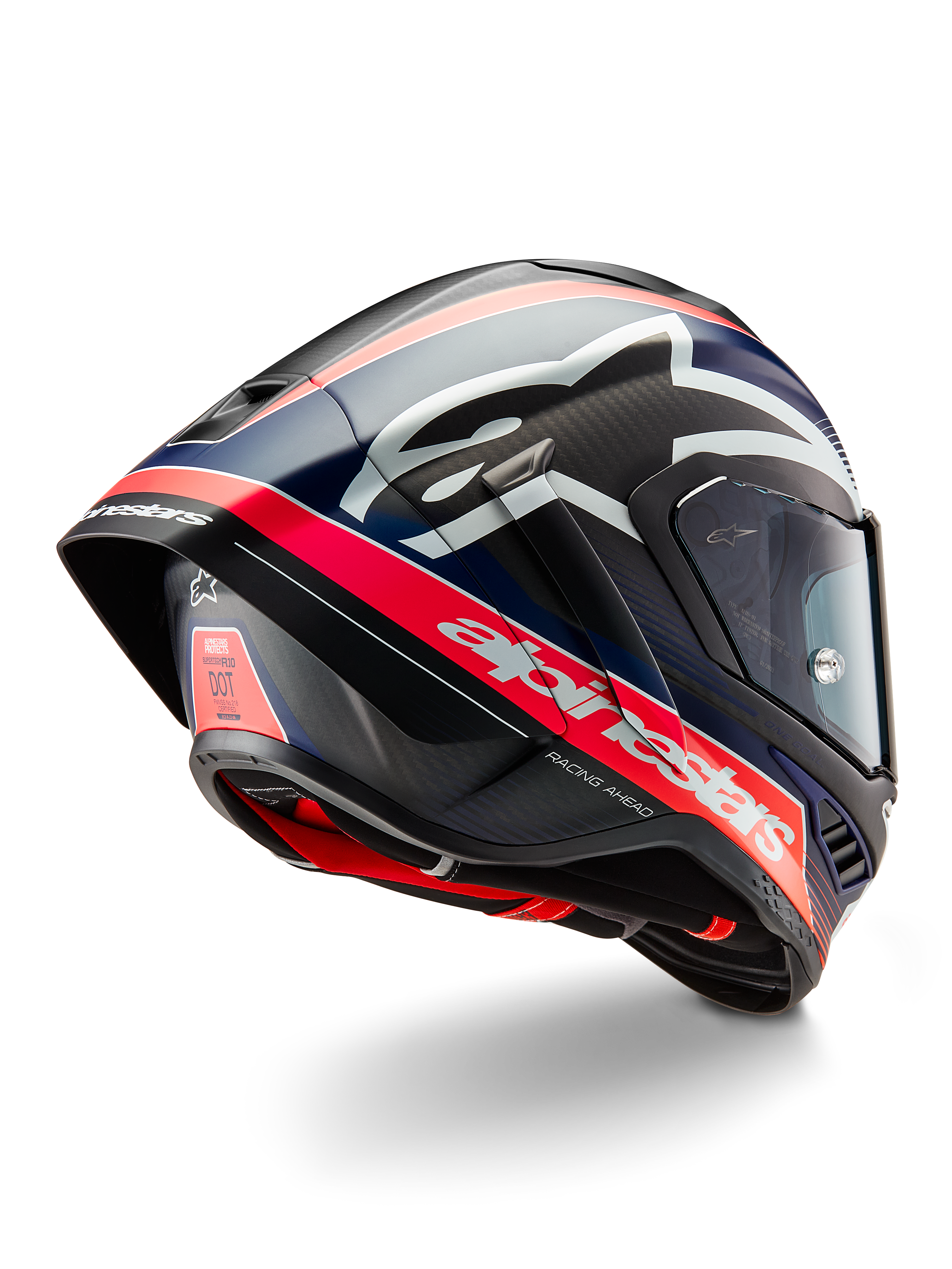 Kask Alpinestars Supertech R10 Team, profesjonalny kask motocyklowy wyścigowy, czarny karbon z fluorescencyjnymi czerwonymi i matowymi niebieskimi akcentami, aerodynamiczny widok z tyłu pokazujący zintegrowany spojler, wyraźne logo Alpinestars oraz widoczną teksturę skorupy z włókna węglowego.