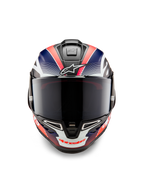 Kask Alpinestars Supertech R10 Team, motocyklowy kask wyścigowy, czarny karbon z matową niebieską i czerwoną grafiką fluo, widok z przodu z ciemną dymioną szybką, aerodynamiczny design ze zintegrowanymi otworami wentylacyjnymi, profesjonalny sprzęt wyścigowy