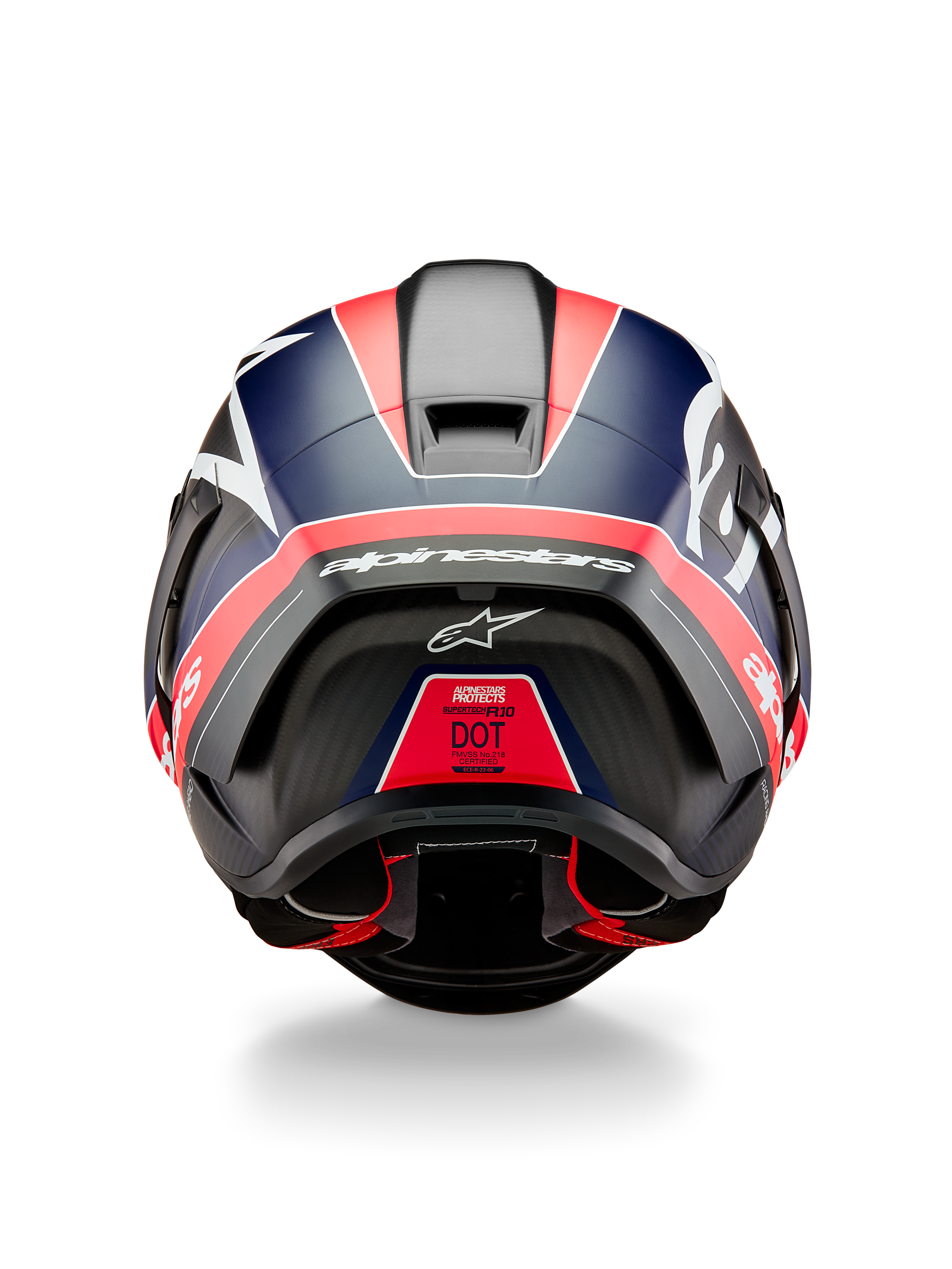 Kask Alpinestars Supertech R10 Team, widok z tyłu, czarny karbon z akcentami w kolorze fluo czerwonym i matowym niebieskim, aerodynamiczny spojler, wyraźne białe logo Alpinestars, etykieta certyfikacji DOT, profesjonalny sprzęt do sportów motorowych