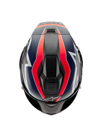 Alpinestars Supertech R10 Team Helmet, widok z góry, czarny karbon z grafikami w kolorze fluorescencyjnej czerwieni i matowego niebieskiego, aerodynamiczna skorupa z górnymi otworami wentylacyjnymi i wyścigowymi akcentami