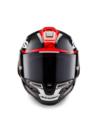 Kask Alpinestars Supertech R10 Element, czarny karbon z jaskrawoczerwoną i białą połyskującą grafiką, widok z przodu z ciemnym wizjerem, widoczną teksturą włókna węglowego i zintegrowaną wentylacją, profesjonalny kask motocyklowy klasy wyścigowej