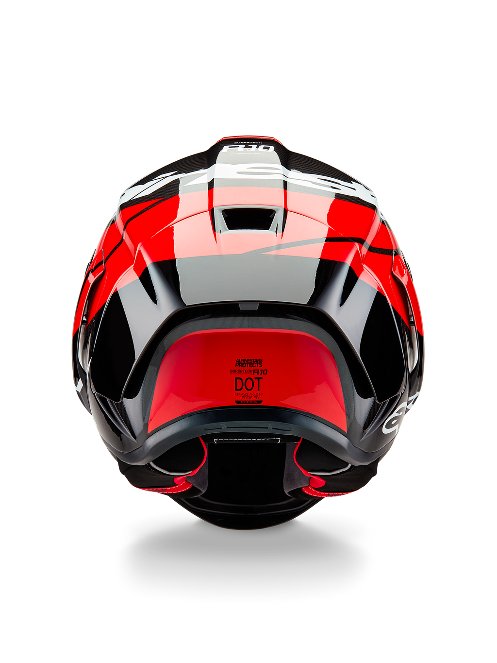 Kask Alpinestars Supertech R10 Element, widok z tyłu, czarny karbon z jaskrawoczerwonymi i białymi błyszczącymi akcentami, aerodynamiczny tylny spojler, otwory wentylacyjne i certyfikat DOT, wyścigowy design z detalami z włókna węglowego