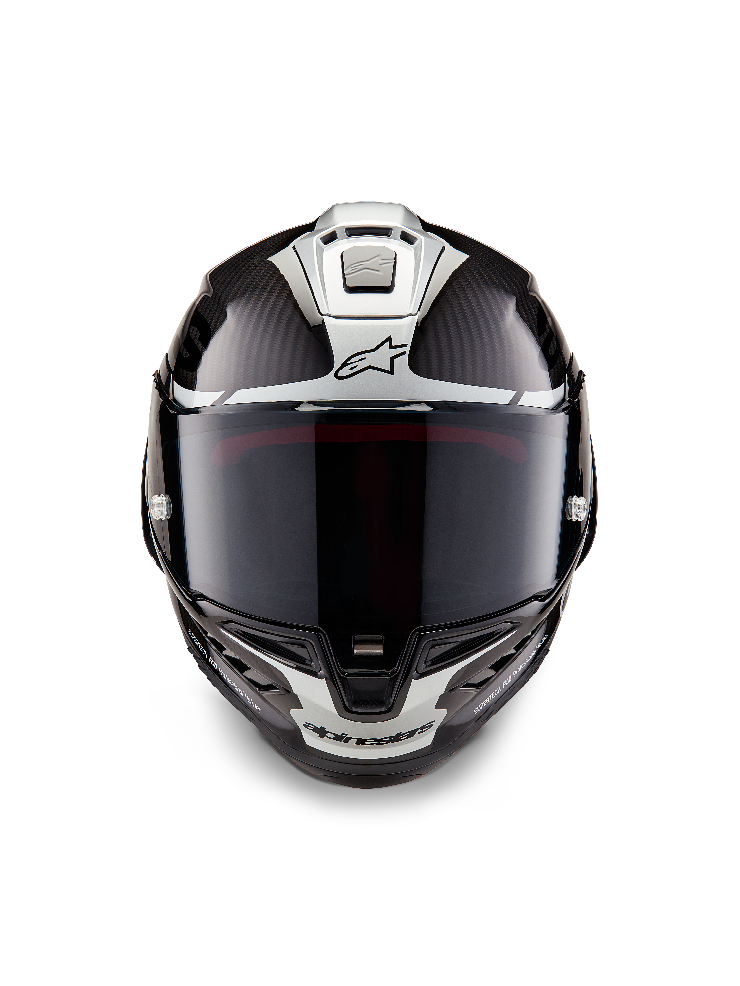 Kask Alpinestars Supertech R10 Element, integralny kask wyścigowy, czarny karbon, srebrny i czarny połysk, widok z przodu z ciemnym dymionym wizjerem, błyszczący splot włókna węglowego, srebrne grafiki aerodynamiczne i logo Alpinestars