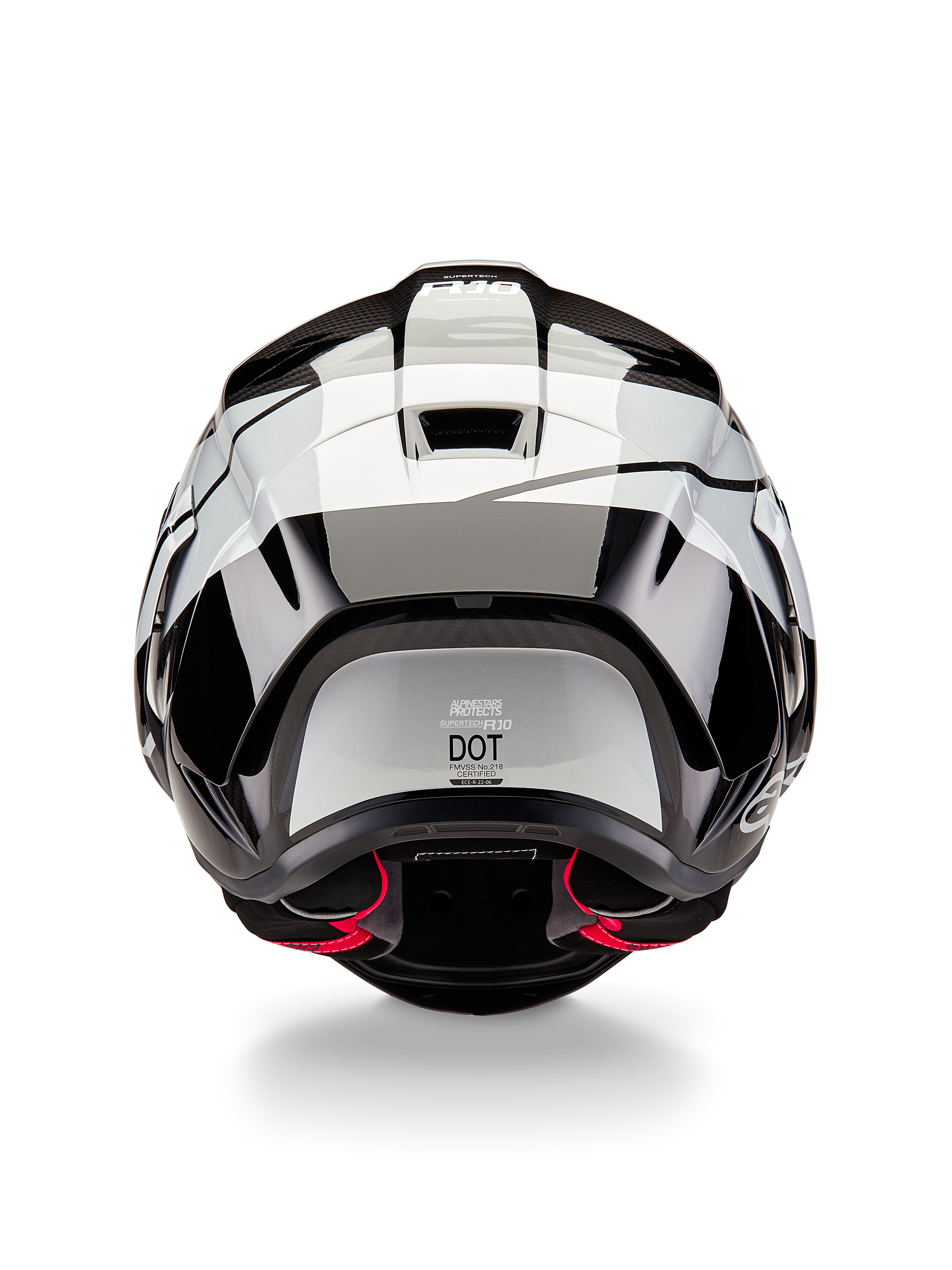 Alpinestars Supertech R10 Element Helmet, widok z tyłu, czarno-karbonowo-srebrny połysk, aerodynamiczny design spojlera, etykieta certyfikatu DOT, czerwone akcenty wewnętrznej wyściółki, profesjonalna wyścigowa ochrona głowy
