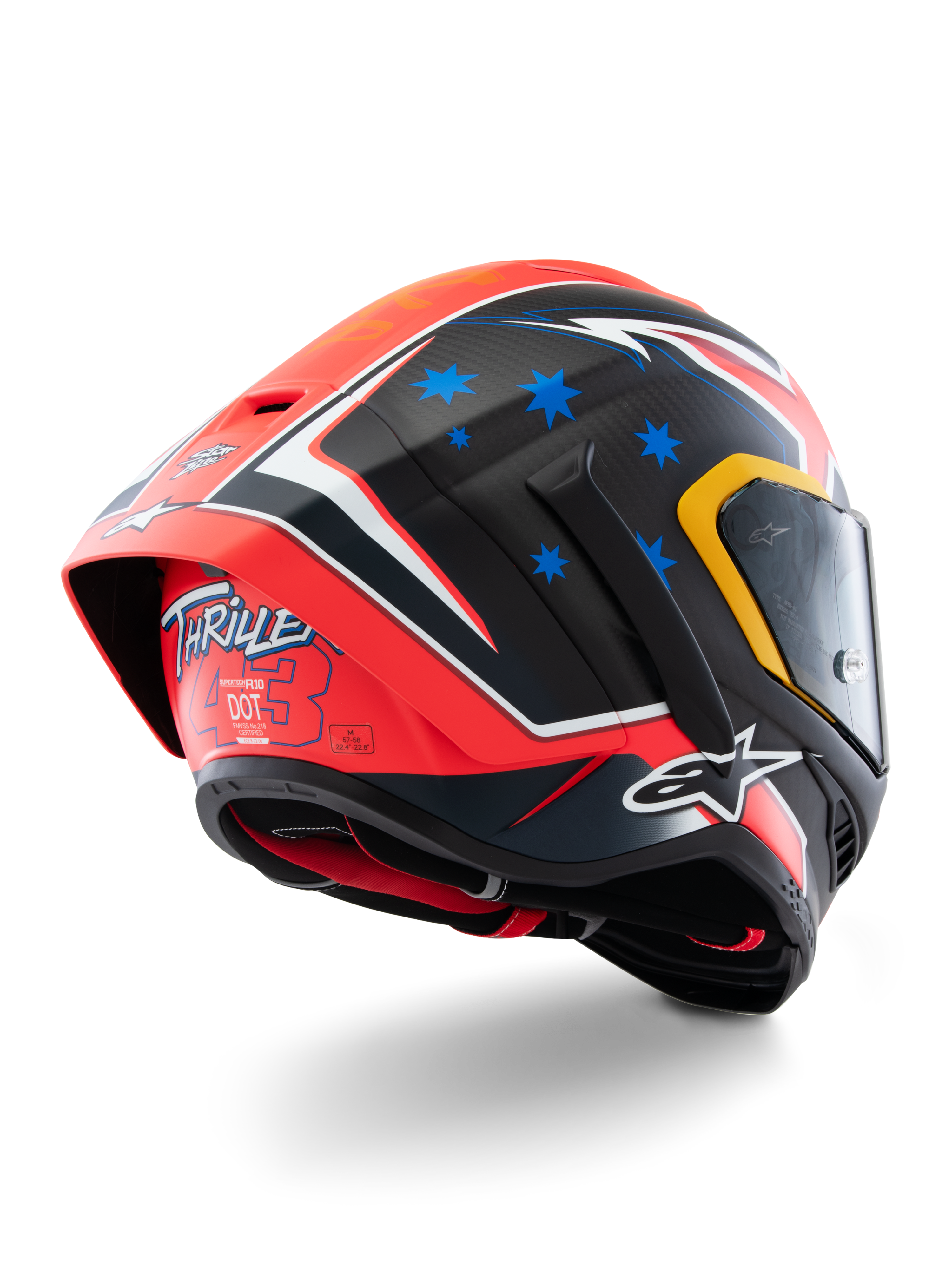 Alpinestars Supertech R10 Miller Limited Edition Helmet, pełnotwarzowy kask wyścigowy, Carbon Red Matt z niebieskimi gwiazdami i białymi akcentami, grafika „Thriller 43” z tyłu, duży aerodynamiczny spojler, konstrukcja z włókna węglowego.