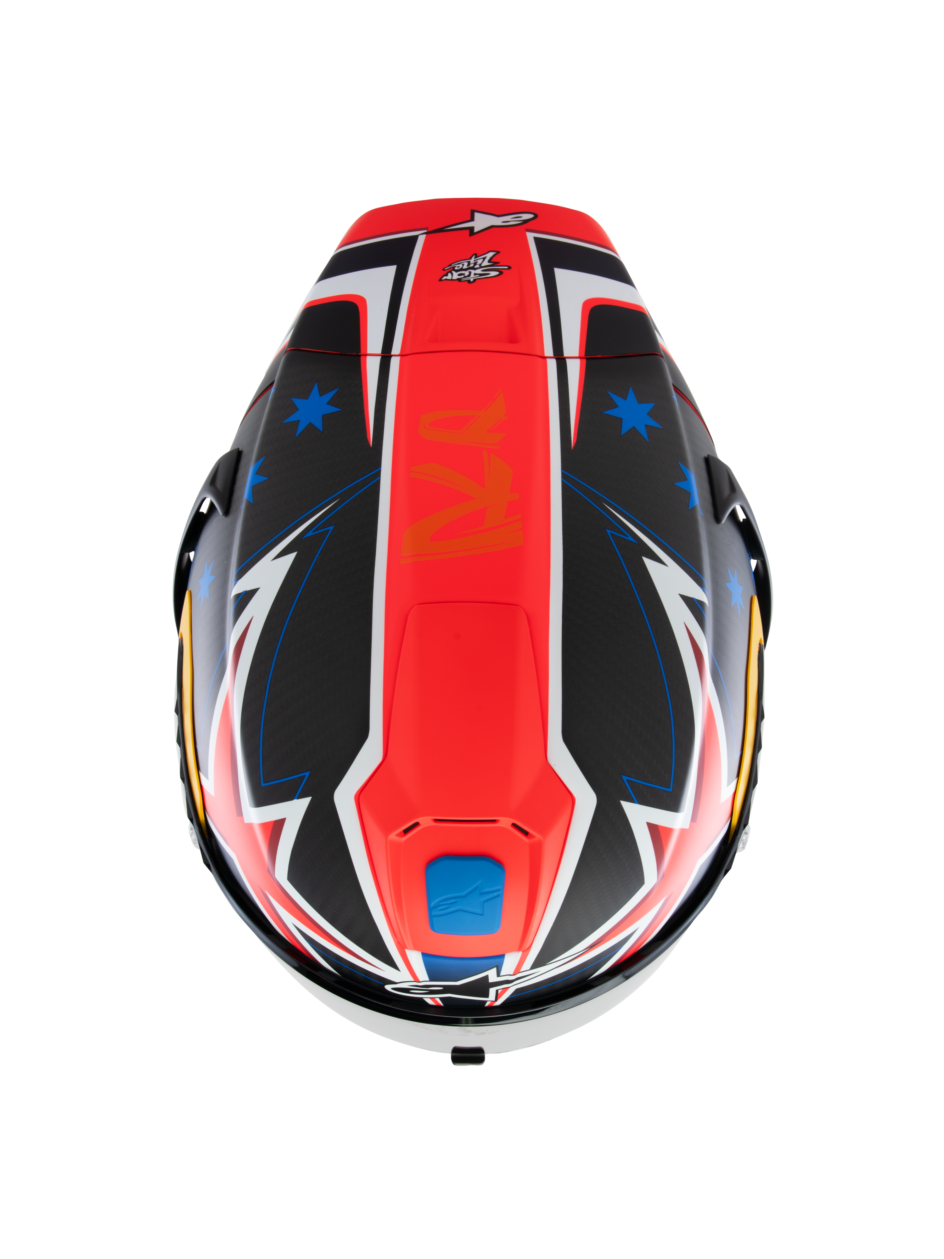 Kask Alpinestars Supertech R10 Miller Limited Edition, widok z góry, matowa grafika Carbon Red z centralnym czerwonym pasem, niebieskie gwiazdy na sekcjach z czarnego włókna węglowego, białe i niebieskie akcenty w stylu błyskawic, aerodynamiczny design wyścigowy