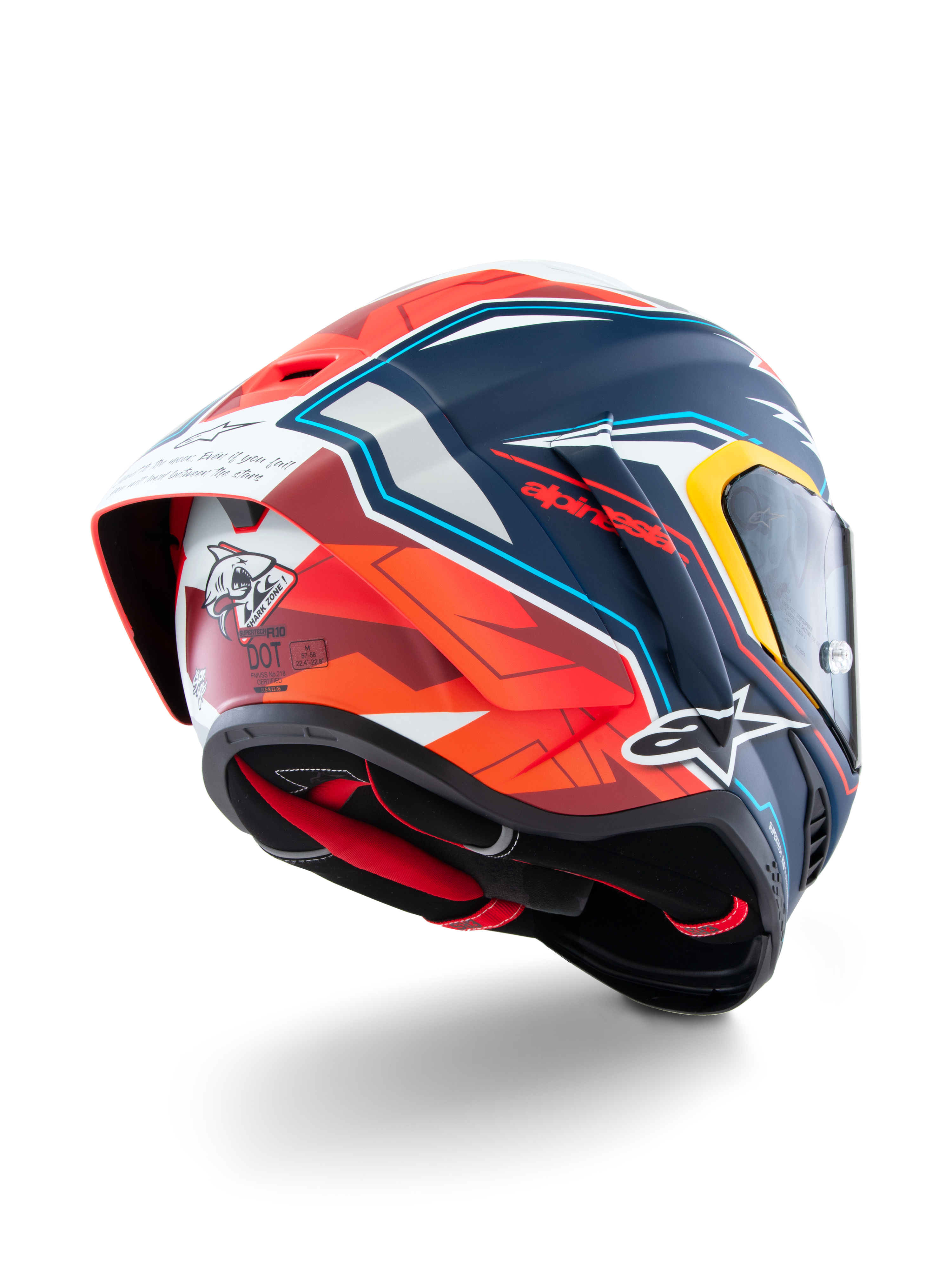 Kask Alpinestars Supertech R10 Acosta Limited Edition, widok z tyłu pod kątem, matowe wykończenie w kolorze niebieskim, czerwonym i białym, z aerodynamicznym spojlerem, grafiką rekina z tyłu, logo Alpinestars i certyfikatem DOT, wysokowydajny wyścigowy kask motocyklowy