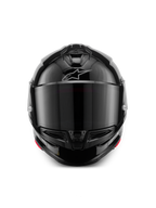 Kask Alpinestars S-R7 Solid, integralny kask motocyklowy, czarny połysk, widok z przodu z ciemnym wizjerem, opływowa aerodynamiczna skorupa z wlotami powietrza na szczęce i górze, subtelne srebrne logo Alpinestars na czole.