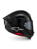 Kask Alpinestars S-R7 Solid, pełny kask motocyklowy, czarny błyszczący, widok z profilu z białym logo A-star, opływowa aerodynamiczna skorupa ze zintegrowanym spojlerem i czerwonymi akcentami u podstawy, zaprojektowany z myślą o wyścigach i sportowych osiągach