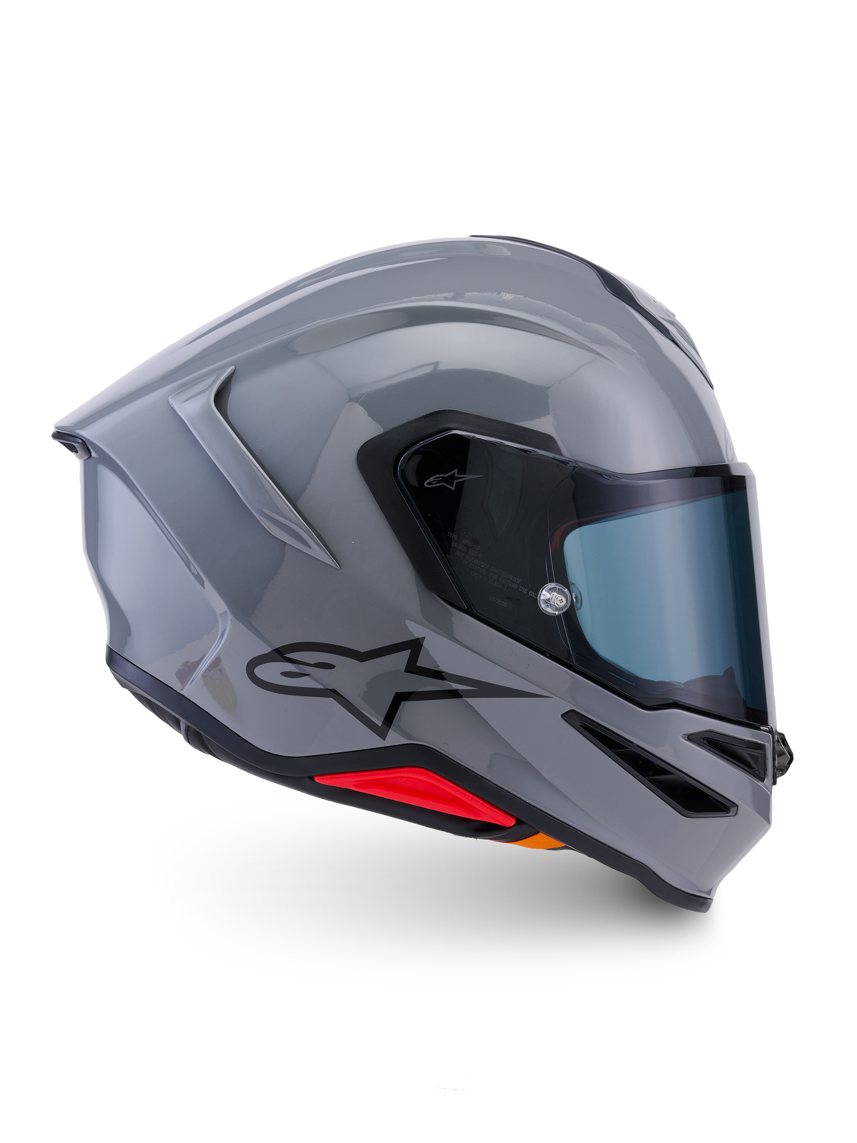 Alpinestars S-R7 Solid Helmet, integralny kask motocyklowy, szary błyszczący, widok z boku, błyszcząca szara aerodynamiczna skorupa z czarnym logo i czerwonymi akcentami u podstawy, wysokiej klasy sprzęt do wyścigów i jazdy sportowej