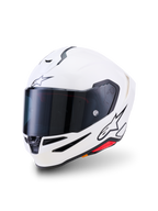 Alpinestars S-R7 Solid Helmet, kask motocyklowy integralny, biały połysk, ciemny dymiony wizjer, czarne logo z gwiazdą na czole i boku, aerodynamiczna skorupa z otworami wentylacyjnymi i czerwonymi akcentami, profesjonalny sprzęt wyścigowy i drogowy