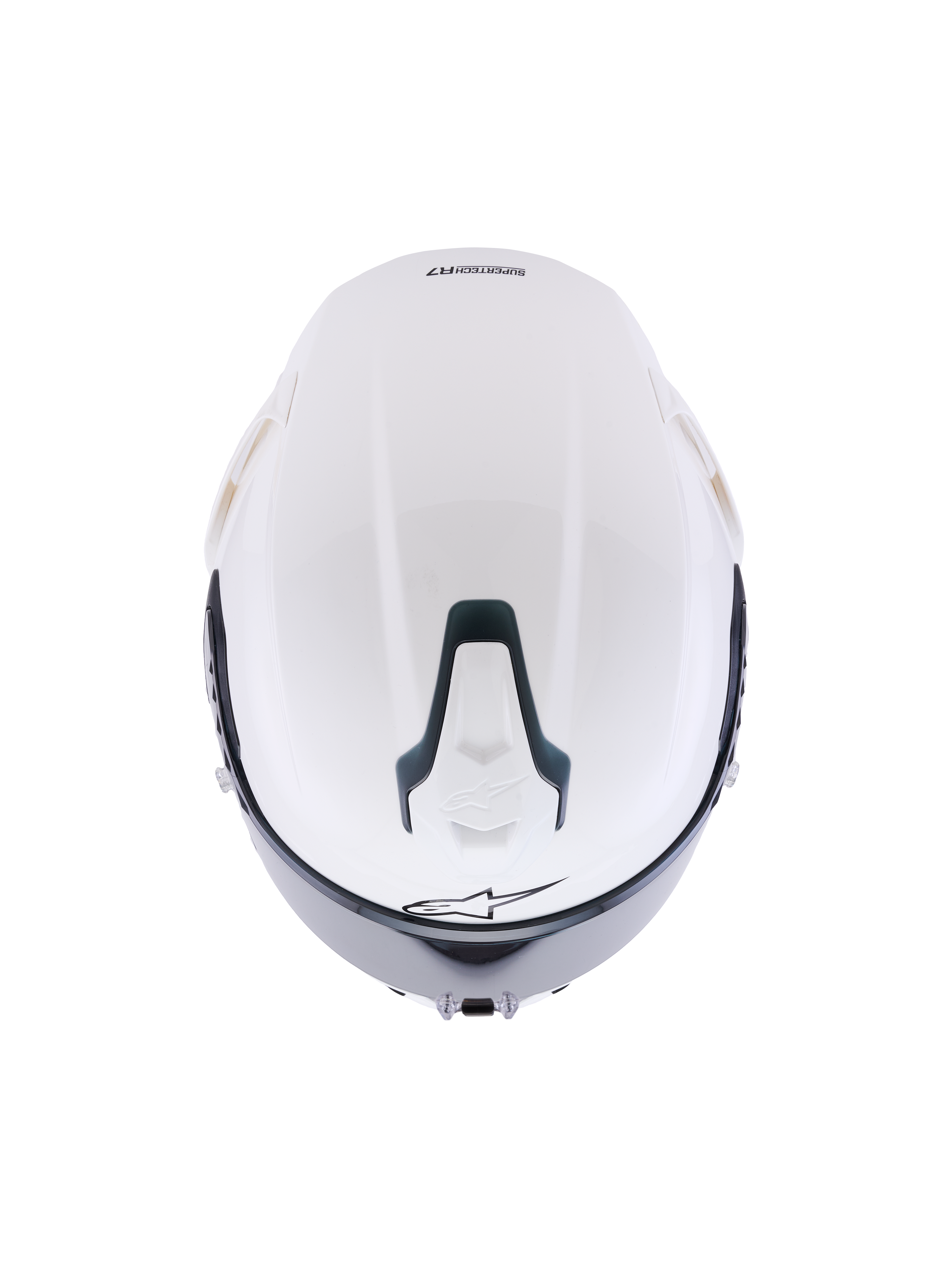 Kask Alpinestars S-R7 Solid, biały błyszczący kask motocyklowy integralny, widok z góry przedstawiający aerodynamiczną skorupę, przesuwny górny wlot wentylacyjny z czarnymi akcentami i charakterystyczne logo gwiazdy, smukły design inspirowany wyścigami zapewniający stabilność przy dużych prędkościach.