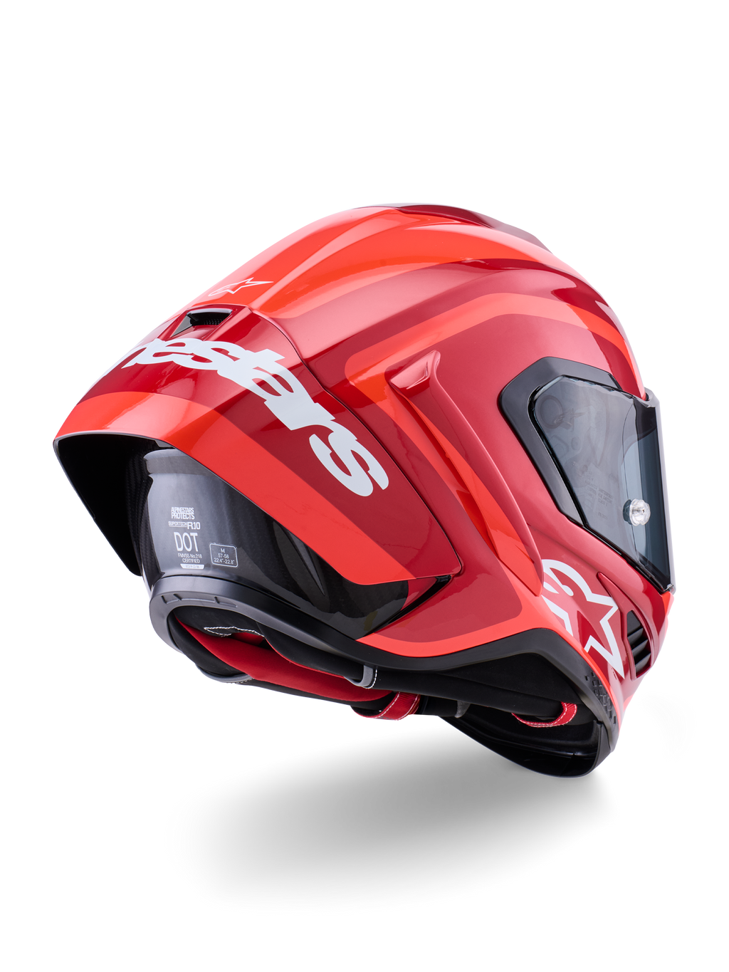 Kask Alpinestars Supertech R10 Arius, czerwony połysk z białymi oznaczeniami marki, widok z tyłu pod kątem trzech czwartych ukazujący aerodynamiczny spoiler, konstrukcja skorupy z włókna węglowego, smukły wyścigowy profil z ciemnym wizjerem