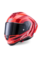 Kask Alpinestars Supertech R10 Arius, wyścigowy kask integralny, czerwono-pomarańczowy z połyskiem, z białymi logotypami Alpinestars, ciemnym przyciemnianym wizjerem, aerodynamiczną konstrukcją z kompozytu węglowego i wielopunktowym systemem chłodzenia