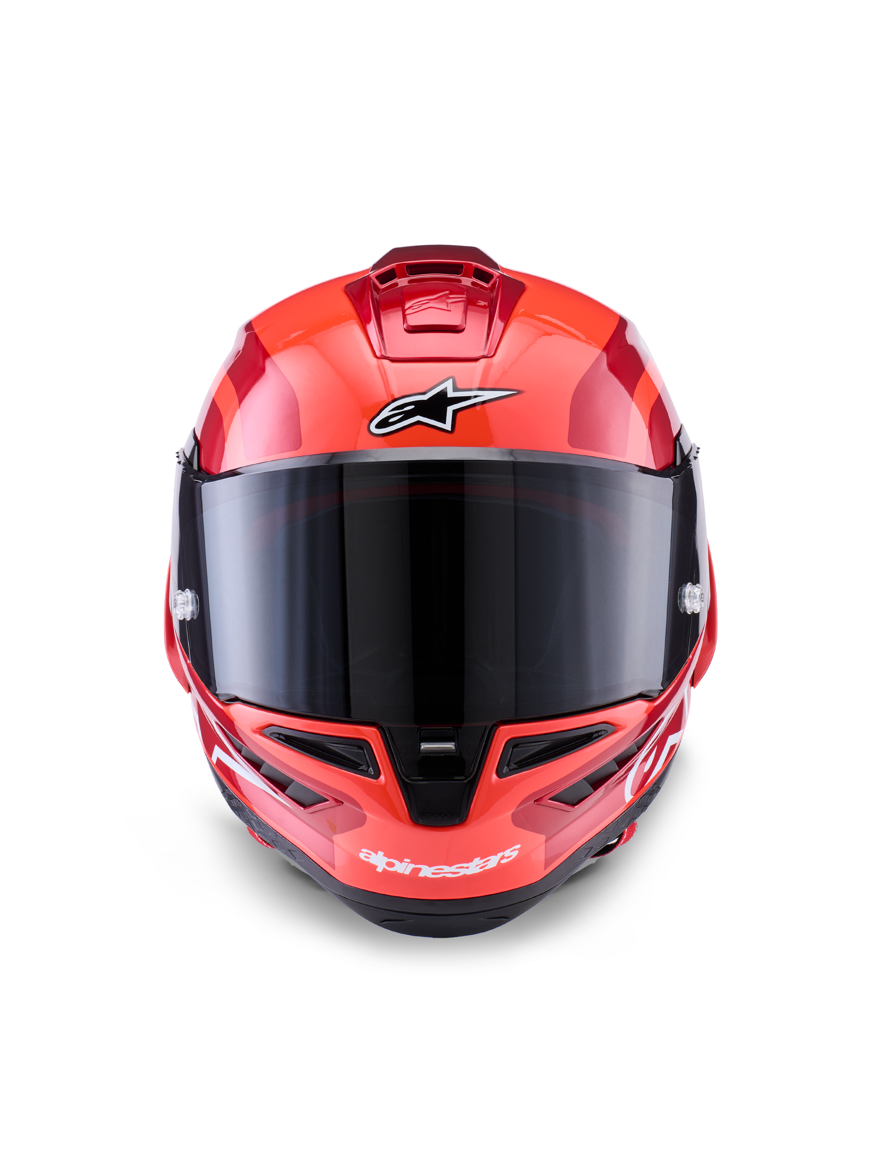 Kask Alpinestars Supertech R10 Arius, integralny kask wyścigowy, czerwony z białymi i czarnymi akcentami, widok z przodu z ciemnym dymionym wizjerem, logo Alpinestars na czole i podbródku, błyszczące wykończenie i aerodynamiczne otwory wentylacyjne