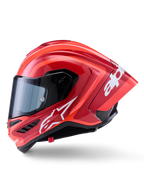 Kask Alpinestars Supertech R10 Arius, wyścigowy kask typu full-face, błyszczący czerwony z białymi grafikami logo, widok z boku podkreślający aerodynamiczny spojler i przezroczysty wizjer, skorupa z kompozytu włókna węglowego do profesjonalnych sportów motorowych