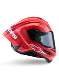 Kask Alpinestars Supertech R10 Arius, integralny kask wyścigowy, błyszczący czerwony i pomarańczowy, widok z boku prezentujący aerodynamiczny tylny spojler, białe logo Astars na szczęce i przezroczysty wizjer, zaprojektowany z myślą o wysokich osiągach na torze