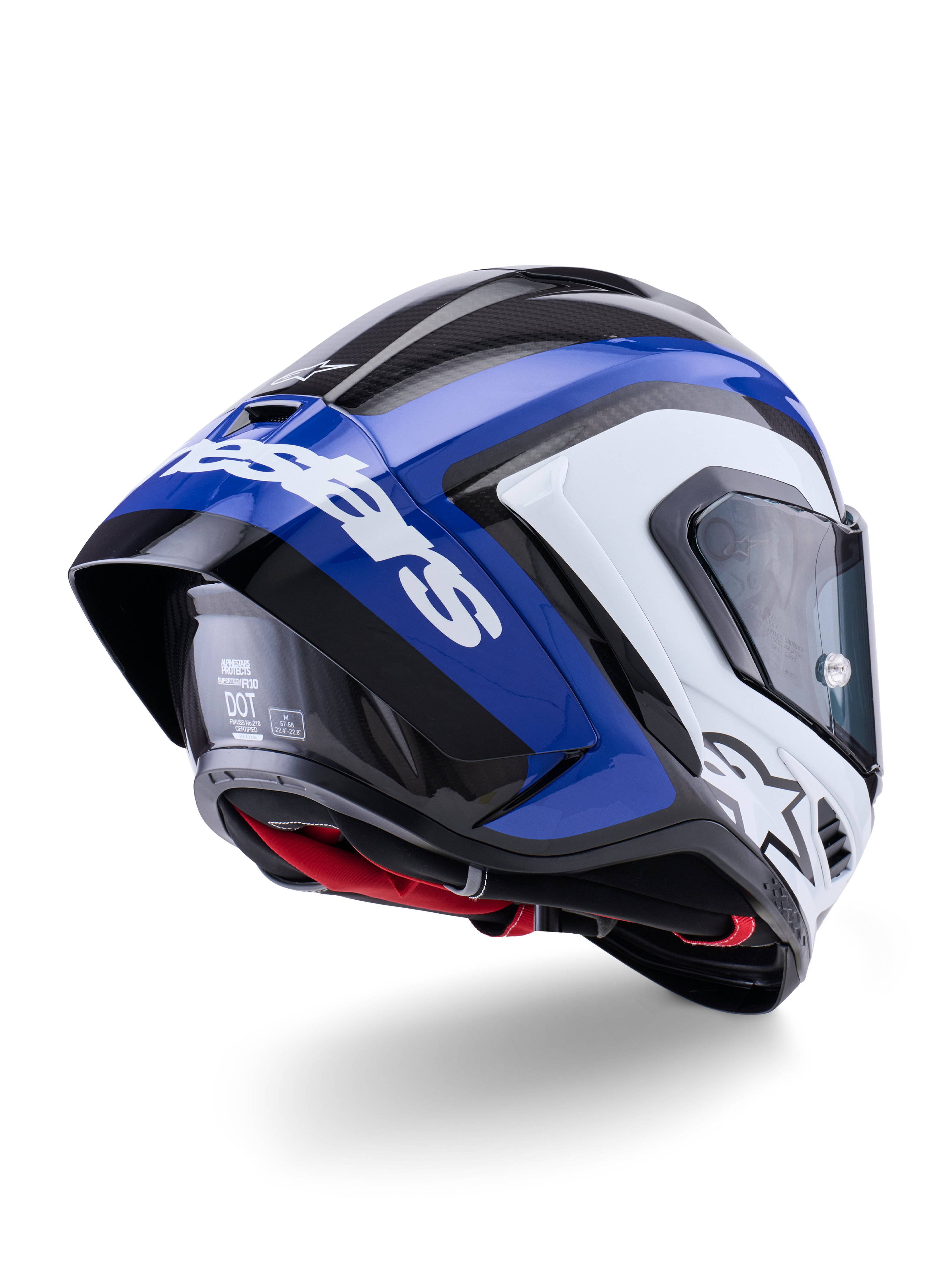 Kask Alpinestars Supertech R10 Arius, wyścigowy kask typu full-face, czarno-biało-niebieski z połyskiem, widok z tyłu pod kątem trzech czwartych ukazujący aerodynamiczny spojler, widoczną teksturę włókna węglowego i wyraźne białe logo Alpinestars