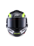 Alpinestars Supertech R10 Arius Helmet, wyścigowy kask motocyklowy, czarny, srebrny i żółty fluo z połyskiem, widok z przodu przedstawiający skorupę z włókna węglowego, ciemny dymiony wizjer i zintegrowany system wentylacji.