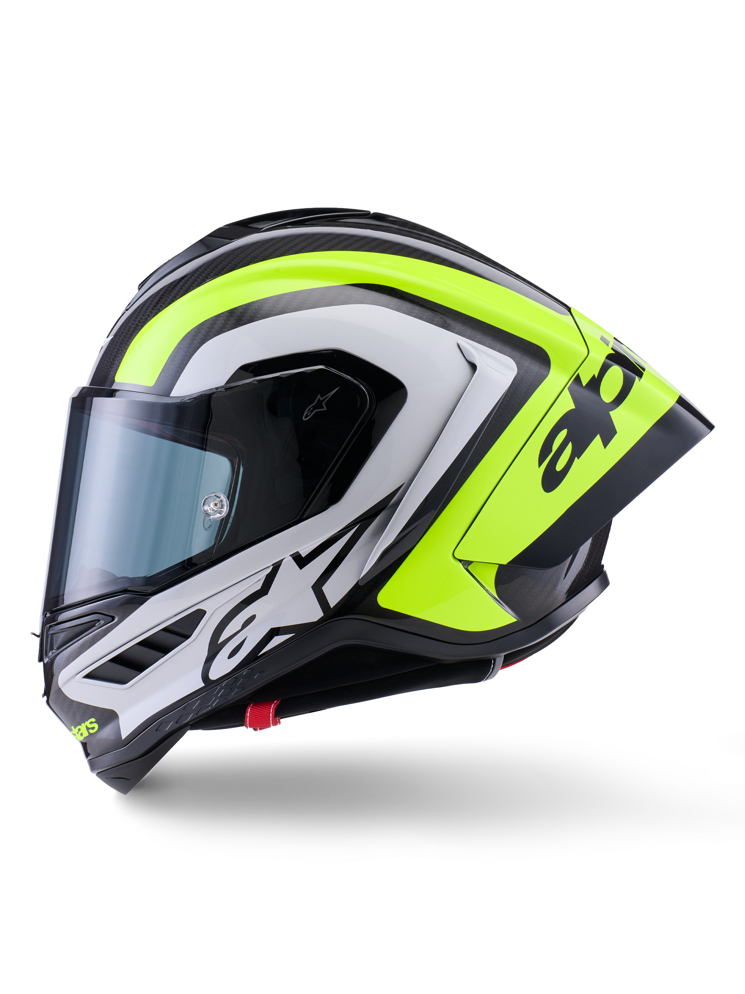 Kask Alpinestars Supertech R10 Arius, wyścigowy kask motocyklowy, czarny, srebrny i żółty fluo z połyskiem, widok z boku, wyposażony w aerodynamiczny tylny spojler, konstrukcję z włókna węglowego, wyraziste oznaczenia marki i przyciemniany wizjer.