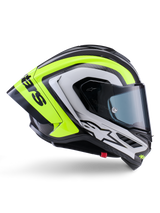 Alpinestars Supertech R10 Arius Helmet, kask wyścigowy typu full-face, czarny, srebrny i żółty fluo z połyskiem, widok z profilu prezentujący aerodynamiczną skorupę i ciemny dymiony wizjer, konstrukcja z włókna węglowego z wyrazistym brandingiem