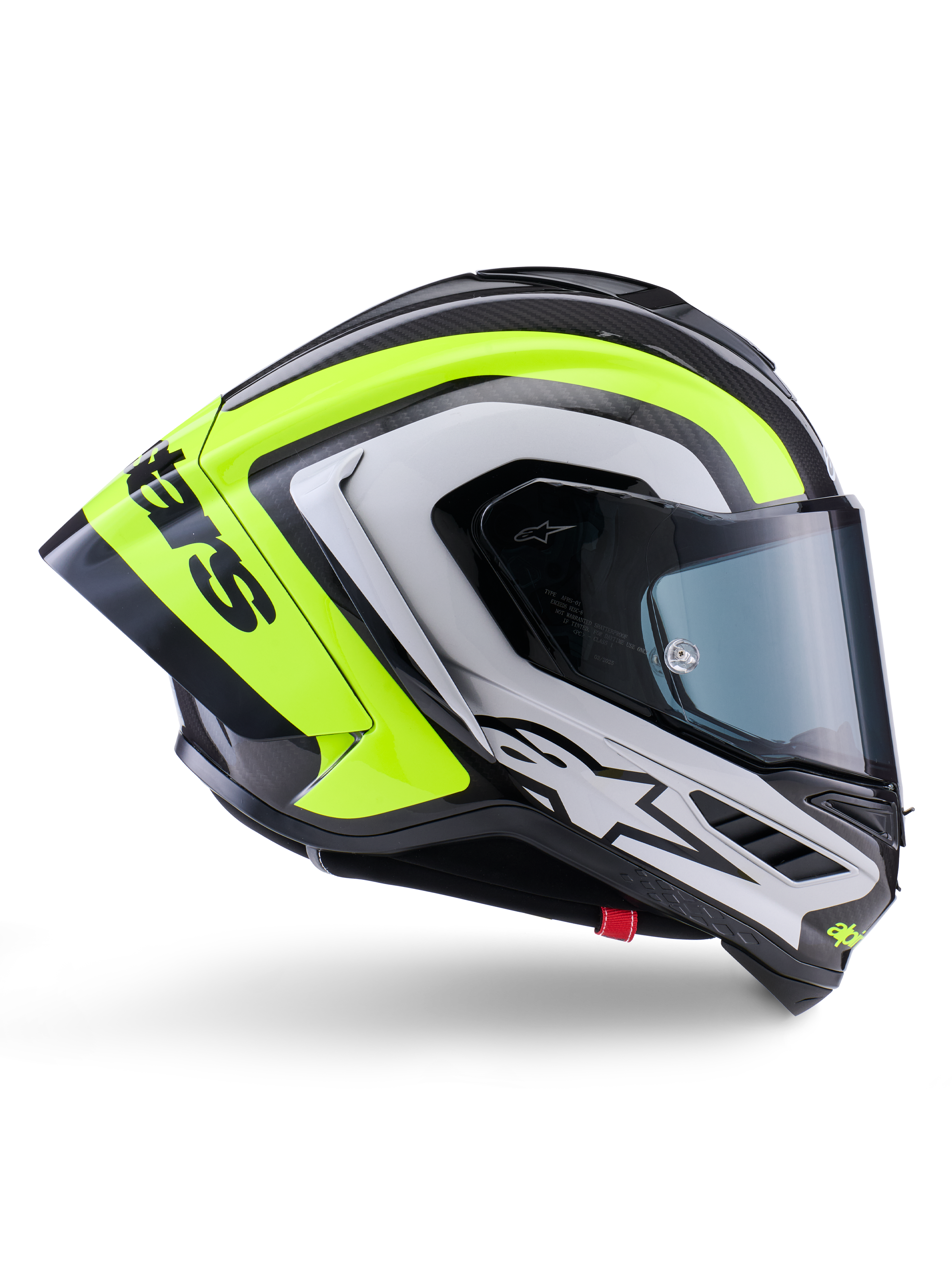 Alpinestars Supertech R10 Arius Helmet, kask wyścigowy typu full-face, czarny, srebrny i żółty fluo z połyskiem, widok z profilu prezentujący aerodynamiczną skorupę i ciemny dymiony wizjer, konstrukcja z włókna węglowego z wyrazistym brandingiem