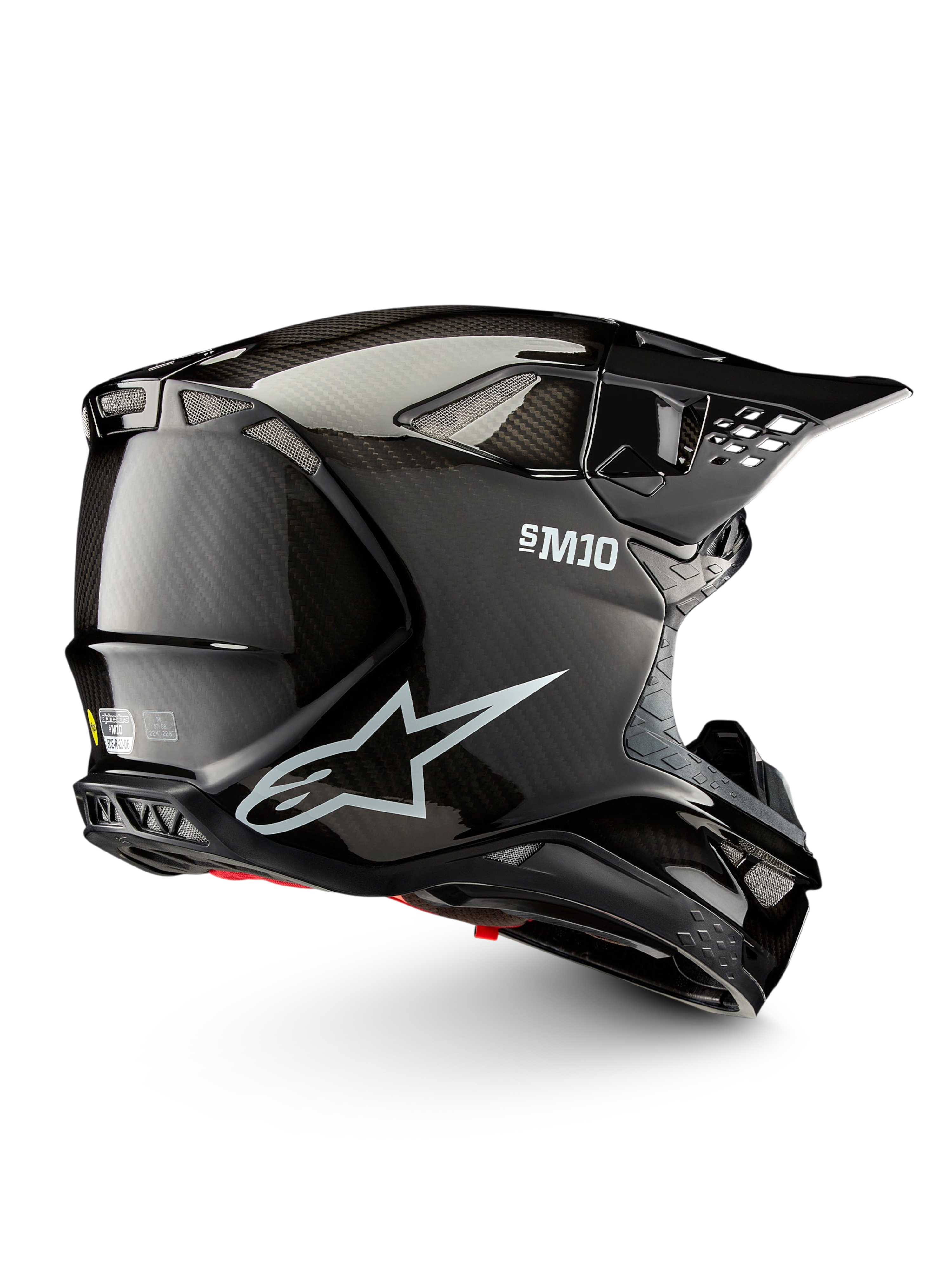 Alpinestars Supertech M10 Solid ECE 22.06, czarny błyszczący kask motocrossowy z włókna węglowego, widok z boku z otworami wentylacyjnymi i daszkiem, certyfikowany ECE 22.06