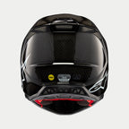 Kask Alpinestars Supertech M10 Solid, czarny połyskujący karbon, widok z tyłu prezentujący splot włókna węglowego, białe logo Alpinestars, naklejki certyfikacyjne MIPS i ECE, aerodynamiczny kształt z otworami wentylacyjnymi