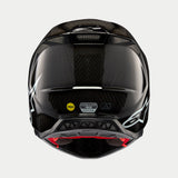 Kask Alpinestars Supertech M10 Solid, czarny połyskujący karbon, widok z tyłu prezentujący splot włókna węglowego, białe logo Alpinestars, naklejki certyfikacyjne MIPS i ECE, aerodynamiczny kształt z otworami wentylacyjnymi