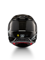 Alpinestars Supertech M10 Solid ECE 22.06, czarny błyszczący karbonowy kask motocrossowy, widok z tyłu, białe grafiki, otwory wentylacyjne, system MIPS, certyfikat ECE-R 22.06