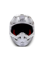 Kask Alpinestars Supertech M10 Solid ECE 22.06, biały błyszczący kask motocrossowy, widok z przodu, czerwone i czarne poduszki wewnętrzne