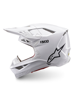 Alpinestars Supertech M10 Solid ECE 22.06, biały błyszczący kask motocrossowy, czarne logo Alpinestars, widok z boku i liczne otwory wentylacyjne