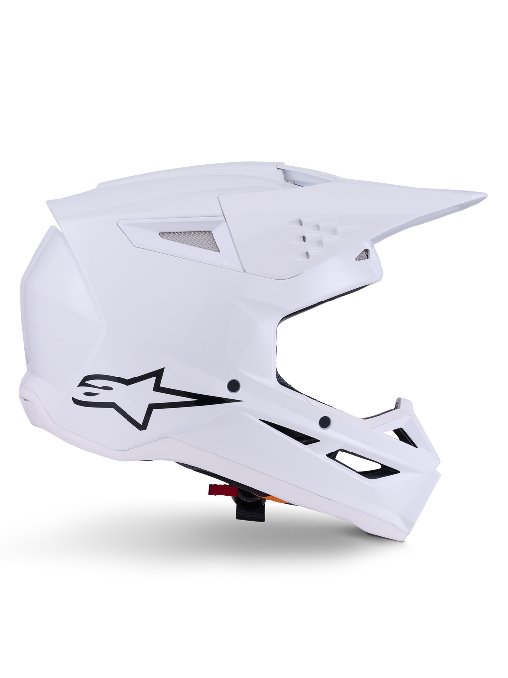 Alpinestars S-M3 Solid Helmet, kask motocrossowy, biały połysk, widok z boku z czarnym logo gwiazdy, kanciasta aerodynamiczna skorupa, liczne otwory wentylacyjne, zintegrowany daszek i osłona szczęki, ochrona do wyścigów terenowych