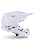 Alpinestars S-M3 Solid Helmet, kask motocrossowy, biały połysk, widok z boku z czarnym logo gwiazdy, kanciasta aerodynamiczna skorupa, liczne otwory wentylacyjne, zintegrowany daszek i osłona szczęki, ochrona do wyścigów terenowych