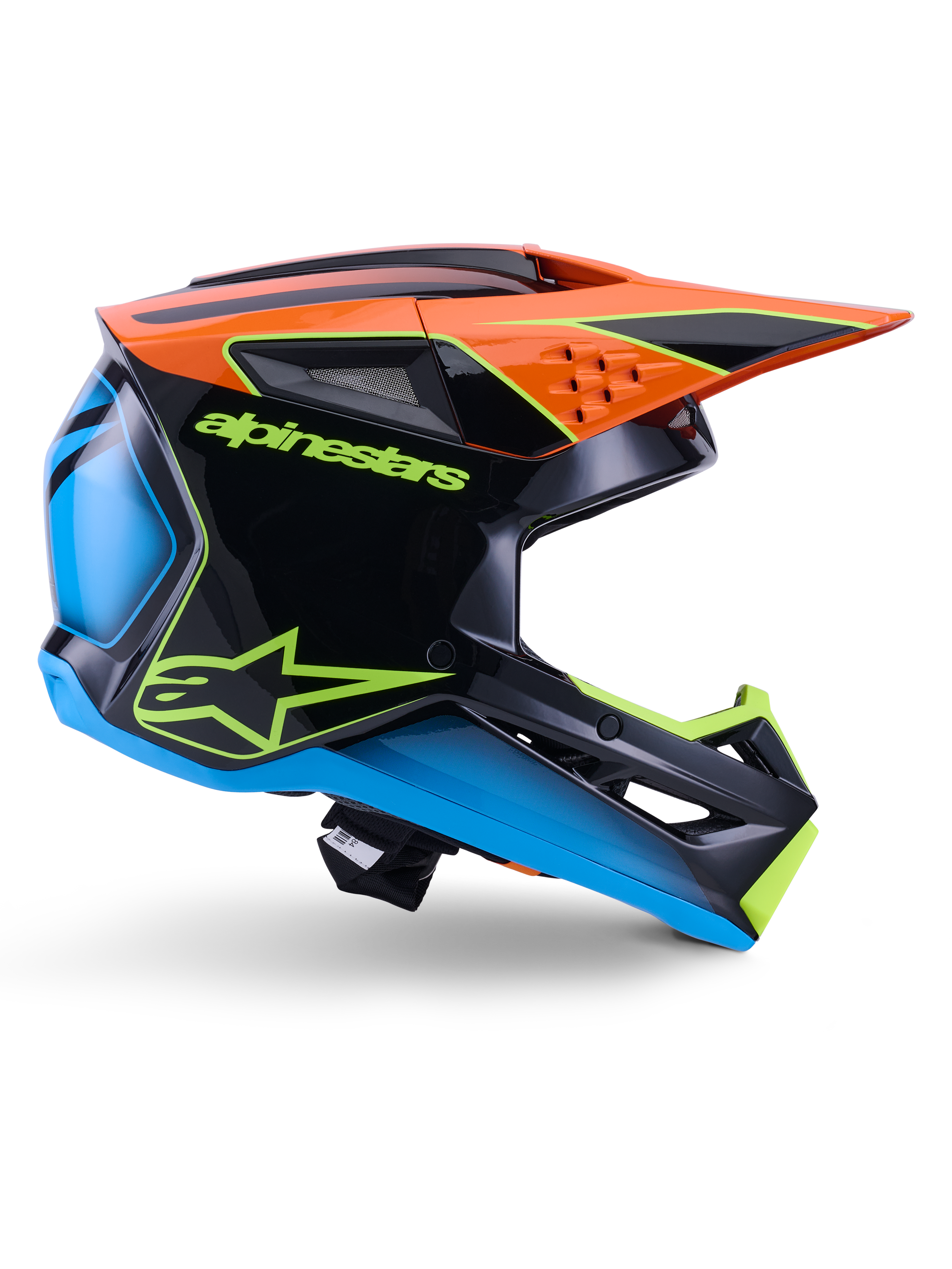 Alpinestars S-M3 Fray Helmet ECE 22.06, kask motocrossowy, czarny, pomarańczowy, niebieski i neonowy żółty, boczny profil błyszczącej aerodynamicznej skorupy z wyraźnym pomarańczowym daszkiem, neonowo-zielone logo i niebieskie akcenty, ochrona do wyścigów terenowych