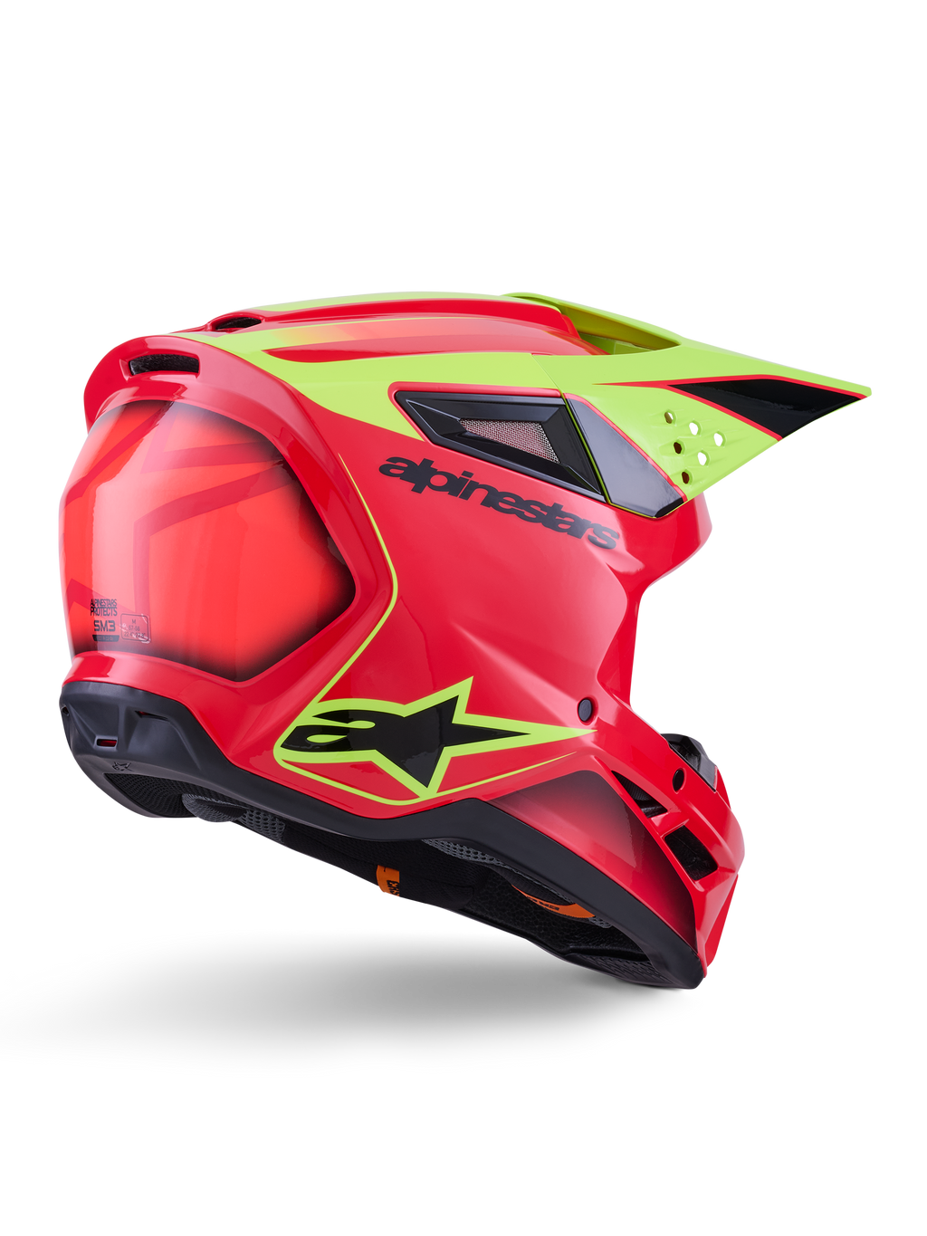 Kask Alpinestars S-M3 Fray ECE 22.06, kask motocrossowy, czerwony, żółty fluo i czarny połysk, widok z tyłu pod kątem ukazujący aerodynamiczną skorupę z licznymi otworami wentylacyjnymi, neonowożółte grafiki i wyraźne czarne logo Alpinestars.