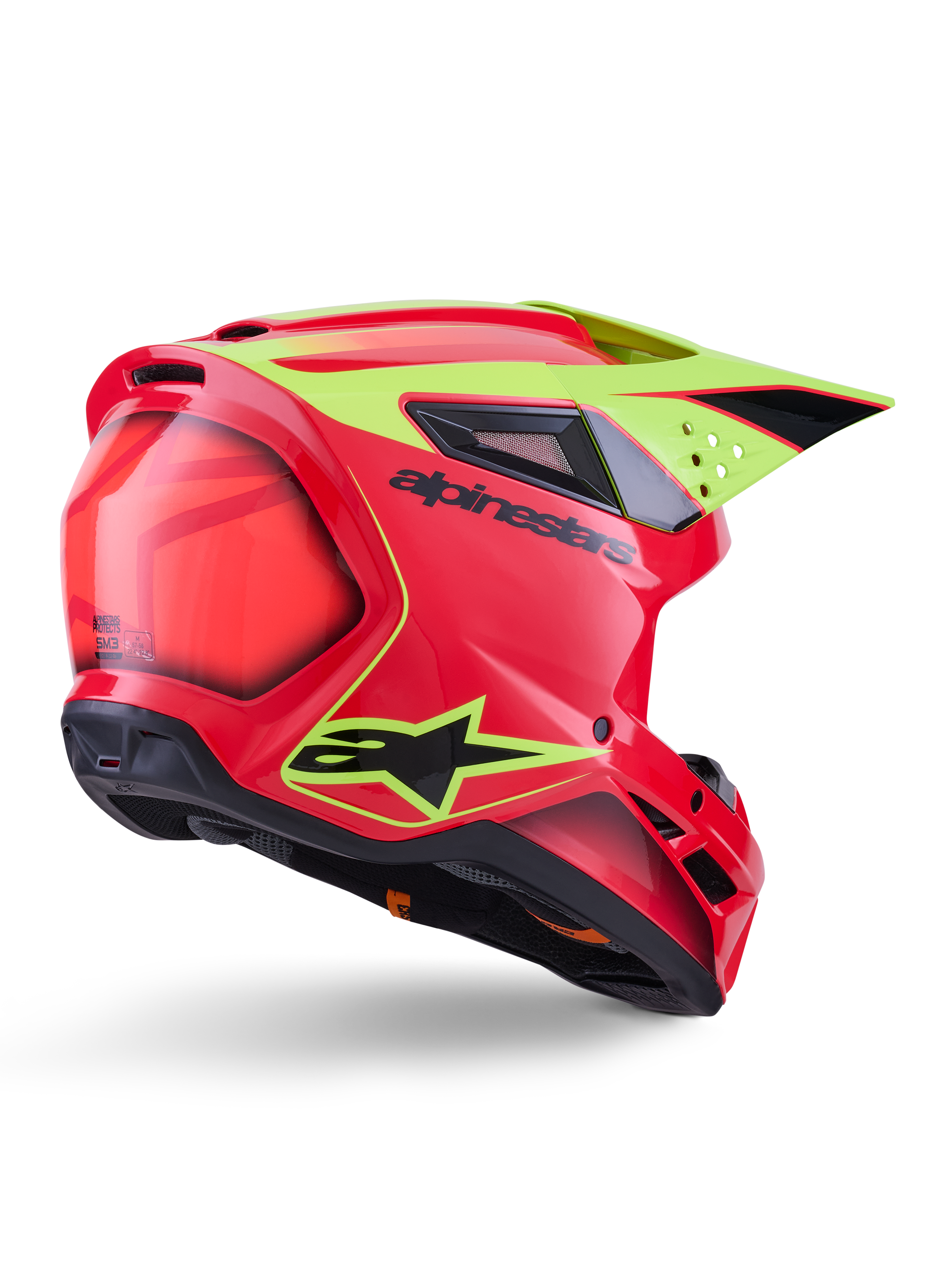 Kask Alpinestars S-M3 Fray ECE 22.06, kask motocrossowy, czerwony, żółty fluo i czarny połysk, widok z tyłu pod kątem ukazujący aerodynamiczną skorupę z licznymi otworami wentylacyjnymi, neonowożółte grafiki i wyraźne czarne logo Alpinestars.