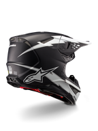 Kask Alpinestars Supertech M10 Ampress, kask motocrossowy, czarno-biały mat, z wyrazistą grafiką białych błyskawic na czarnej matowej skorupie, widok z tyłu pod kątem trzech czwartych pokazujący branding Alpinestars i otwory wentylacyjne